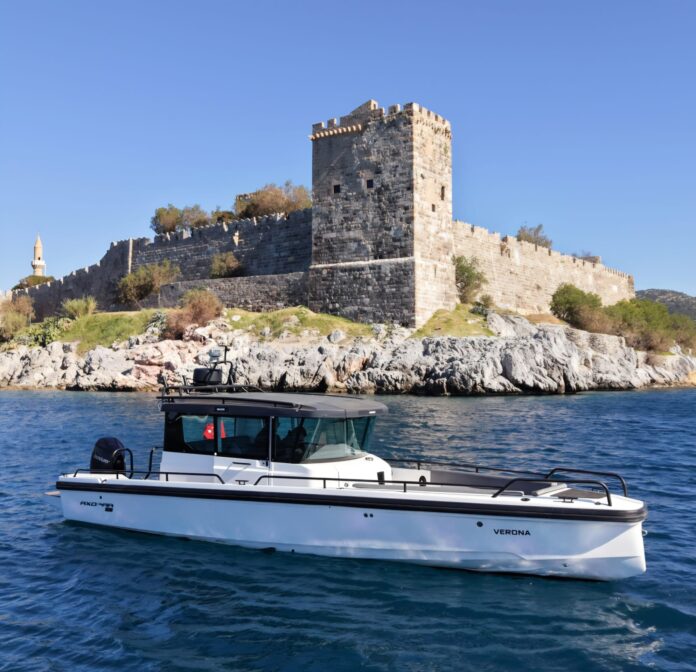 LUXURY SPEEDBOAT TOURS FROM BODRUM private Axopar speedboat cruising along the Bodrum coastline with turquoise sea and luxury lifestyle experience