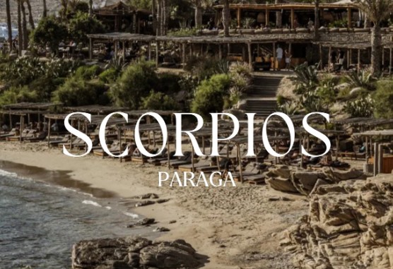 SCORPIOS IN MYKONOS 2026 luxury sunset beach club in Mykonos with bohemian design, elegant lounge beds, beachfront dining, live DJ performance, golden sunset atmosphere, and exclusive Aegean party experience in Greece.